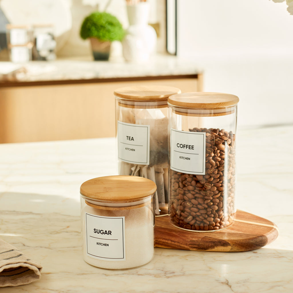 Tea Coffee and Sugar glass pantry jars with bamboo lids by CLOSSY. Each jar is organised and labelled with labels from the Perfect Pantry Label set. 